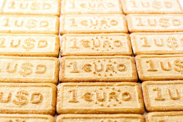 Shortcakes with USD dollar and EURO money symbols, background,selective focus.