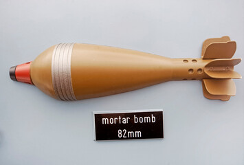 a 82 mm mortar bomb example on a stand