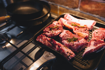 Preparing steak on the grill pan with seasonings