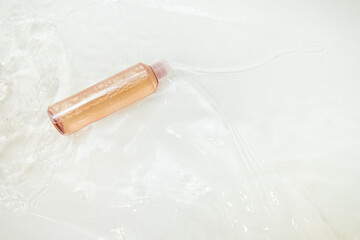 Colorful bottles with body lotion and shower gel flat lay. Clean skin and body care concept. Top horizontal view copyspace