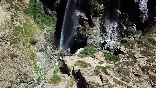 Waterfall with rainbow Gorges de la Restonica Corte on the island of Corsica