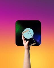 A hand holds a square vinyl music record on a yellow-pink gradient background