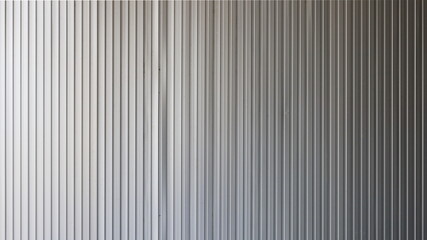 Obraz premium Old corrugated aluminum walls. White metal plate for industrial building or warehouse walls and uneven exposure.Silver corrugated metal texture background with copy space. Selective focus