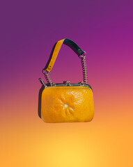 Surreal bright women bag. On a yellow-pink background. Creative concept of a new fashion