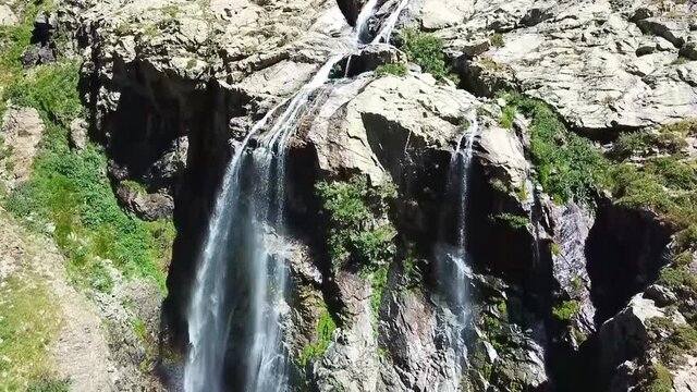 Waterfall with rainbow Gorges de la Restonica Corte on the island of Corsica