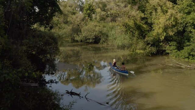 Canoeing insummer sunlight Tisza river passage, Lake Tisza, Hungary