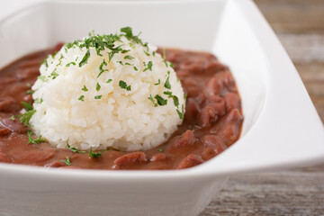 A closeup view of a bowl of red beans and rice.