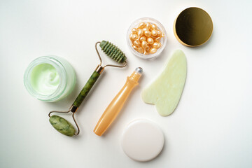 Organic Facial cosmetics. Spa treatments. Jade roller for facial massage. essence for skin health. gouache scraper, face cream, ampoules for wrinkles on the eyelids.