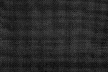 Fototapeta na wymiar Jute hessian sackcloth canvas woven texture pattern background in light black color blank empty.