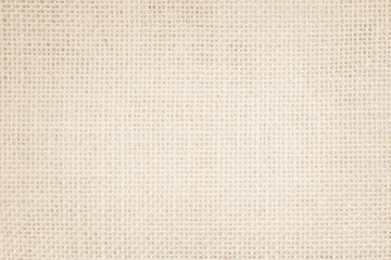 Jute hessian sackcloth canvas woven texture pattern background in light beige cream brown color blank empty