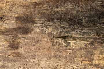 Obraz premium Warm wooden table texture flat lay photo. Timber board with weathered crack. Rustic wooden table top view