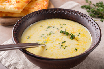 Cheese soup with thyme close-up. Vegetarian food.
