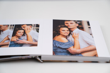 pages of photobook from photo shoots of a beautiful happy couple 