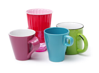 Colorful cups on white background 