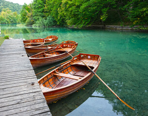 wooden pleasure boats are waiting for tourists