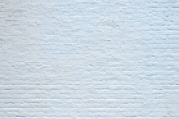 light blue plastered brick wall background
