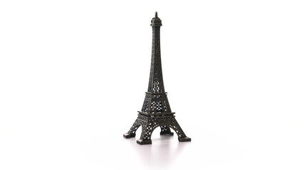 toy metal eiffel tower spins on turntable. Rotation of historic symbol of France with inscription Paris. Miniature replica of the tall tower