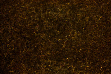 Background image of black Japanese paper mixed with golden fibers