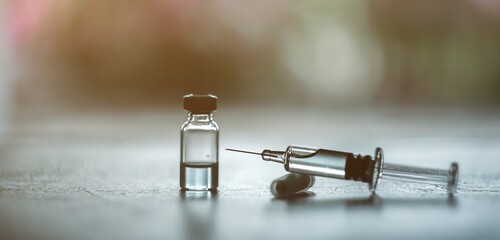 Trial vaccine coronavirus deverlopment vial dose flu shot drug needle syringe,medical concept vaccination hypodermic injection treatment disease care hospital prevention immunization illness disease.