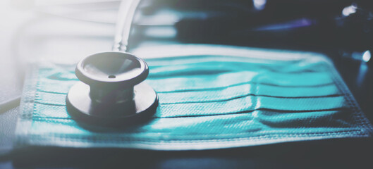 Stethoscope medical drug vaccine syringe needle hypodermic injection treatment on map world ,Medical concept tourism travel care diseases Healthy .blue background. selective focus stethoscope map