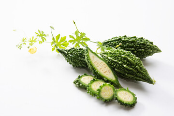 Fresh bitter gourds on white background
