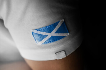 Patch of the national flag of the Scotland on a white t-shirt