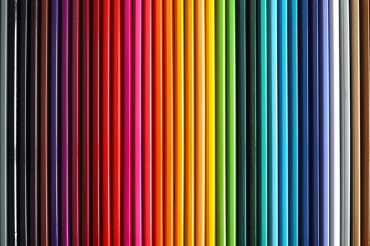 Colored pencils palette. School supplies for kids. Colorful wooden pencils lined up.