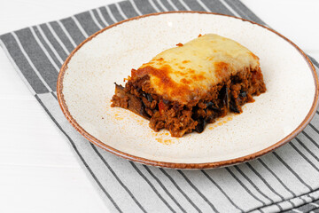 Piece of fresh meat lasagna with cheese