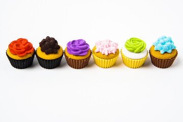 View of miniature toy kitchenware and foods on white background. Image with selective focus and flat lay.
