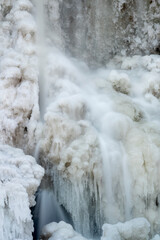 Winter's Frozen Cascade: a Powerful Wintry Waterfall in Nature's Beauty