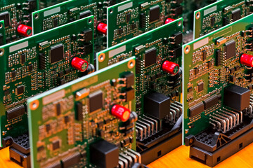 Elecronic Concepts. Stack of Newly Produced Automotive Printed Circuit Boards with Soldered Surface...