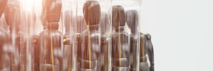 Ikea business figures. Extraordinary team model. Meeting mannikin. Wooden people mall. Black color. Horizontal banner. Soft focus