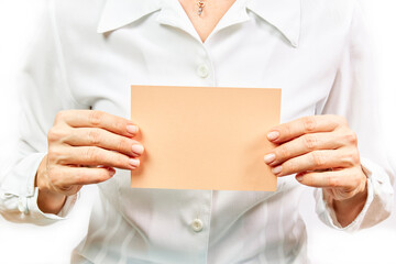 Business woman holding empty orange card on white background