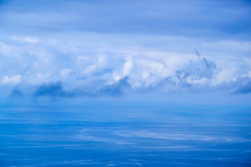 Blue clouds over the water surface.