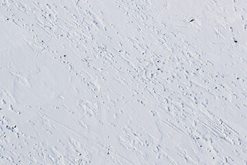 drone shot of footprints in the snow texture