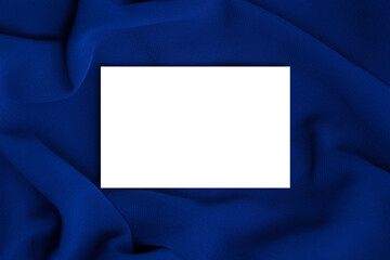 White business card mockup on blue fabric. Template with space for text.