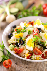 mixed vegetable salad with rice, egg and tomato