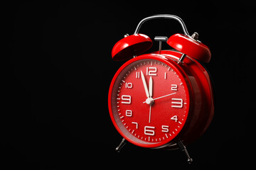 Alarm clock on black background