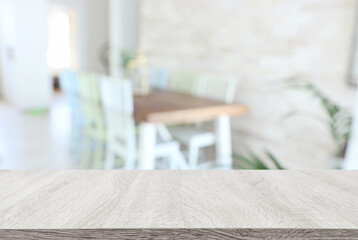 empty table board and defocused modern kitchen dining table background. product display concept