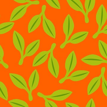 Seamless pattern with green doudle leaves. Orange background. Autumn, spring or summer. Nature and ecology. For packaging design and wrapping paper. For wallpaper, scrapbooking, textile and post cards
