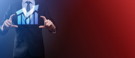 Development and growth concept.Businessman hold graph growth and increase of chart positive indicators in his business,in hand.
