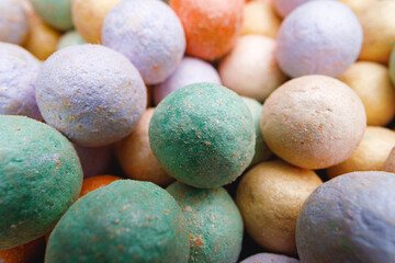 Multicolored make-up powder in balls close up