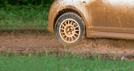 Fototapeta na wymiar Rally racing car on muddy track.