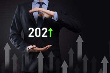 Business development to success and growing growth year 2021 concept.Plan business growth graph in year 2021 concept.Businessman plan and increase of positive indicators in his business