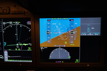 displays and cockpit layout of a modern passenger jet airplane 