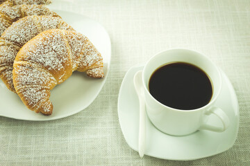 Coffee and croissant on white background