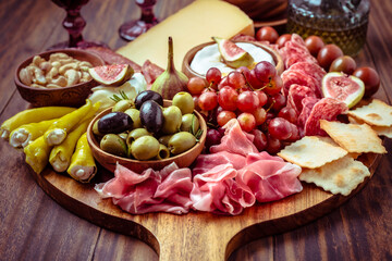 Charcuterie, antipasti platter with assortment of italian salami, cheese, camembert and olives