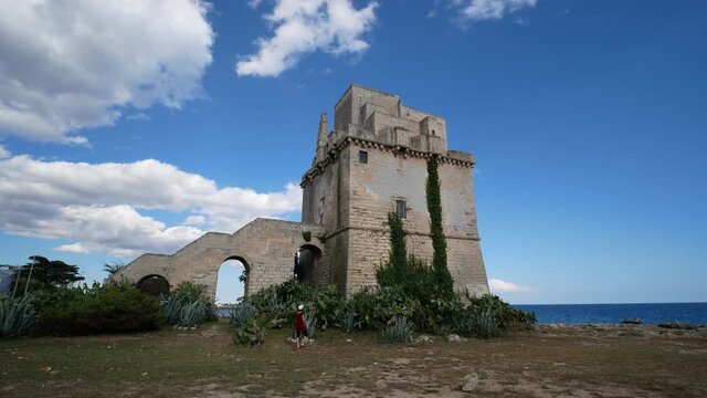 Picturesque historical fortification tower Torre Colimena on Salento Ionian sea coast, Taranto, Puglia, Italy