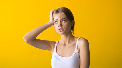 Young beautiful woman having headache