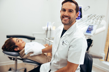 Fototapeta premium Successful male dentist in his clinic